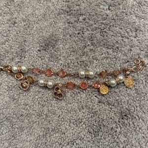 Henri Bendel Elegant Gold and Pink Charm Bracelet